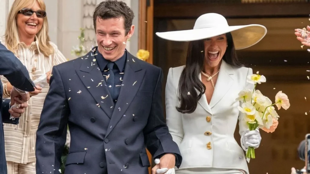 Pop star Dua Lipa in a custom white lace wedding gown alongside husband Callum Turner in Sicily.